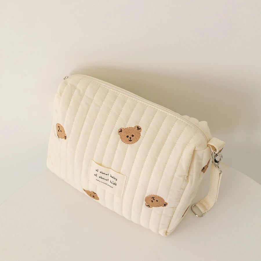 Bolsa de pañales bordada con estampado floral