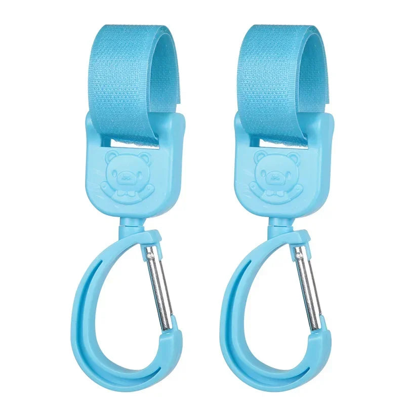 Ganchos giratorios para cochecito (2 uds.)