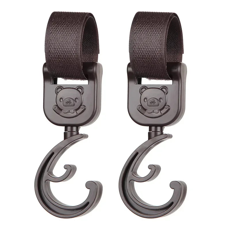 Ganchos giratorios para cochecito (2 uds.)